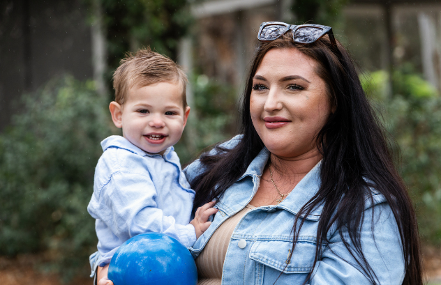 Mum and son looking at camera smiling Mum and son looking at camera smiling