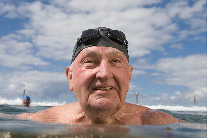 Older male swimming